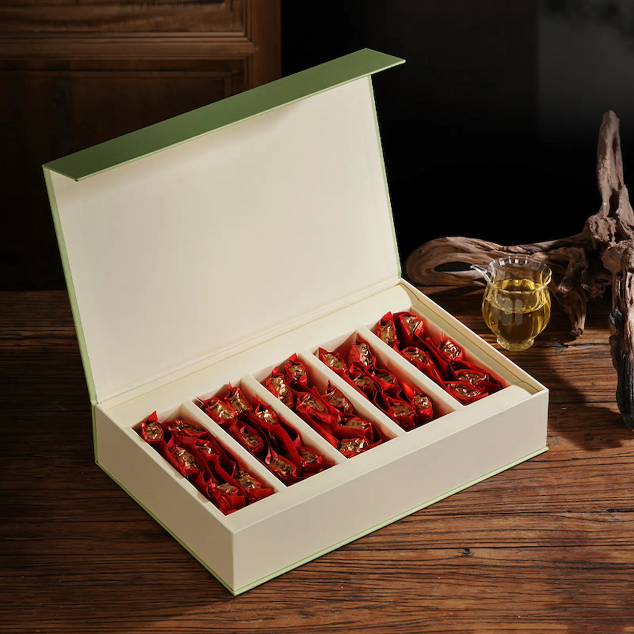 Premium Anxi Tie Guan Yin oolong tea gift box with individually wrapped tea packets, elegant design perfect for gifting or storing authentic Chinese oolong tea. Ideal for tea lovers and special occasions.
